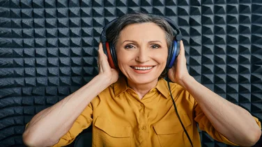 woman having speech therapy test through headphones